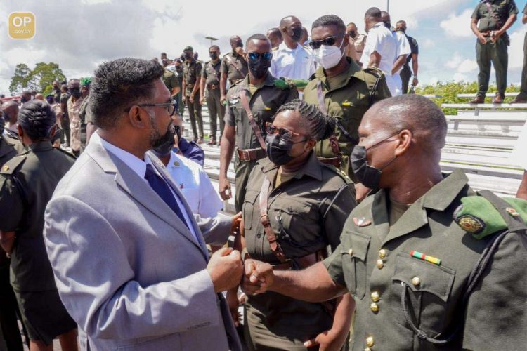 President Irfaan Ali (left) in dialogue with soldiers yesterday (Office of the President photo)