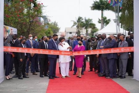 First Lady Arya Ali (right) and Prime Minister of Barbados, Mia Mottley cutting the ribbon to open up the international energy conference yesterday at the Marriott Hotel. (Office of the President photo)