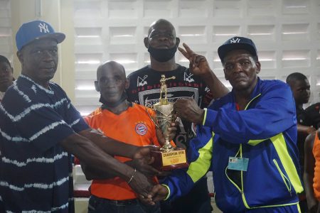 Best Boxer! Jeremiah Duncan poses with his coach, Clifton Barker after being adjudg-ed the best boxer of this year’s Pepsi/Mike Parris U-16 Championships was staged yesterday at the Andrew ‘Sixhead’ Gym.