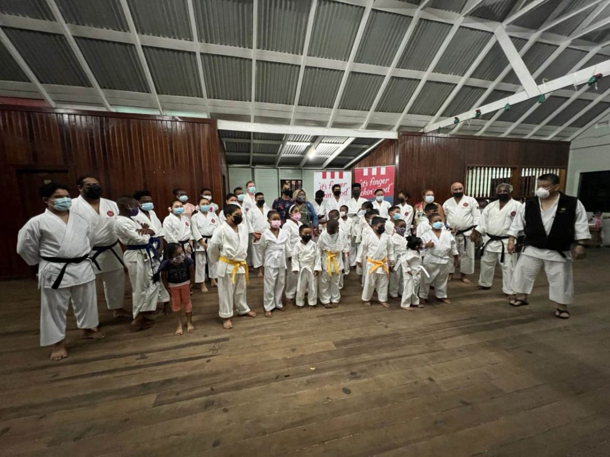 Master Frank Woon-A-Tai (extreme right) with representatives of KFC Guyana and members of the Guyana Karate Daigaku.
