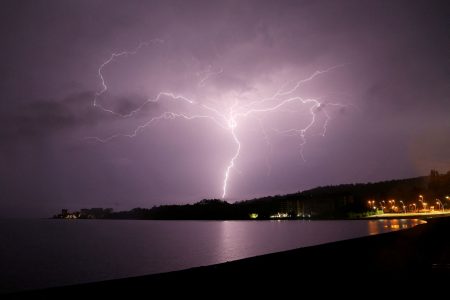 Lightning strikes are seen above Villarrica lake, in Villarrica, Chile, December 7, 2021. REUTERS/Cristobal Saavedra Escobar/