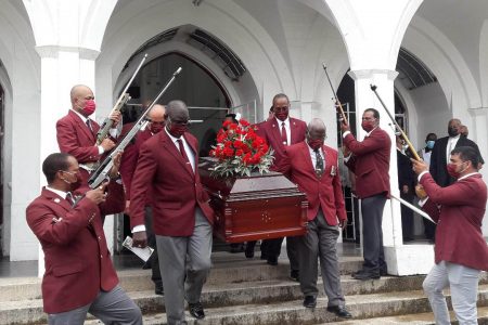  Pall bearers, including former Assistant Commissioner of Police, Paul Slowe, removing the casket with the body of the late Neville Denny from the Cathedral of the Immaculate Conception, Brickdam.