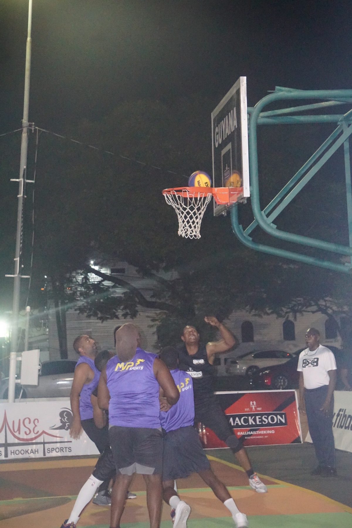 Part of the action between Pitbull (black) and Vertically Challenged fixture at the Burnham Court in the Rawle Toney 3×3 Basketball Classic