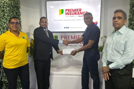 CEO of Premier Insurance, Anil Singh (second from left) hands over the sponsorship cheaque to DCB secretary, Devteerth Anandjit in the presence of DCB Administrator Kavita Yadram (left) and Assistant Secretary Ronald Williams