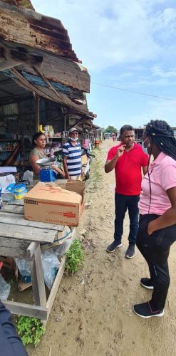 Minister within the Ministry of Public Works, Deodat Indar standing along the road at the Leonora Market, West Coast Demerara (MoPW photo)