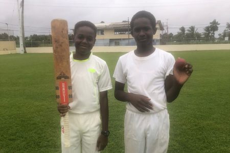 Krishna Silas (left) made 60 while Brandon Henry picked up six wickets for four runs for Georgetown