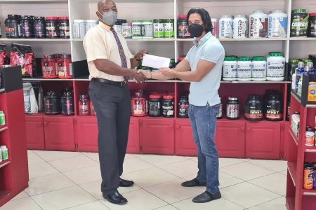 Jamie McDonald, CEO of Fitness Express, the leading supplement and gym apparel supplier in the 592 handed over a financial pact to President of the powerlifting federation, Gordon Spencer who thanked McDonald for his continued show of support.
