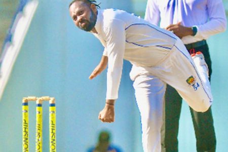 Left-arm spinner Jomel Warrican sends down a delivery during his six-wicket haul. (Photo courtesy CWI Media) 