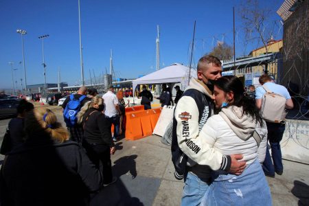 A Russian couple embrace as they wait for a humanitarian visa at the San Ysidro Port of Entry of the U.S.-Mexico border in Tijuana, Mexico March 15, 2022. Picture taken March 15, 2022. (REUTERS/Jorge Duenes/file photo)
