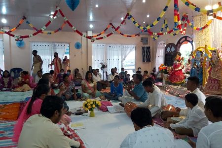 The Guyana Hindu Dharmic Sabha Essequibo Coast Praant on Sunday last hosted its Annual Phagwah Chowtaal Samelan at the Hibernia Mandir, in Region Two. Participating in this year’s Chowtaal singing were members from the Cotton Field, Airy Hall, Spring Gardens, Reliance, Affiance, Johanna Cecilia, Hibernia and Maria’s Lodge mandirs. President of the Essequibo Coast Praant, Pandit Kaydar Persaud, said that the event was organised with the COVID-19 pandemic in mind. He noted that the Chowtaal Samelan is an annual event that kick starts Phagwah celebrations in the Pomeroon-Supenaam region and usually fosters unity and togetherness. Persaud added that he was satisfied with the level of participation given the current pandemic. “We in Essequibo always look forward for Chowtaal Samelan before the burning of Holika, and we always come together and sing,” he said. Persaud also said that he has seen growing Chowtaal circles as a clear indication that a growing number of persons are interested in the artform. He, therefore, encouraged leaders to continue to practice the singing of Chowtaal, Ulara and Holi songs through the festive season. During the festival of colours, mandirs are usually involved in the singing of Chowtaal and the clashing of “Jaals”. In photo mandir members are seen taking part in the Chowtaal samelan.