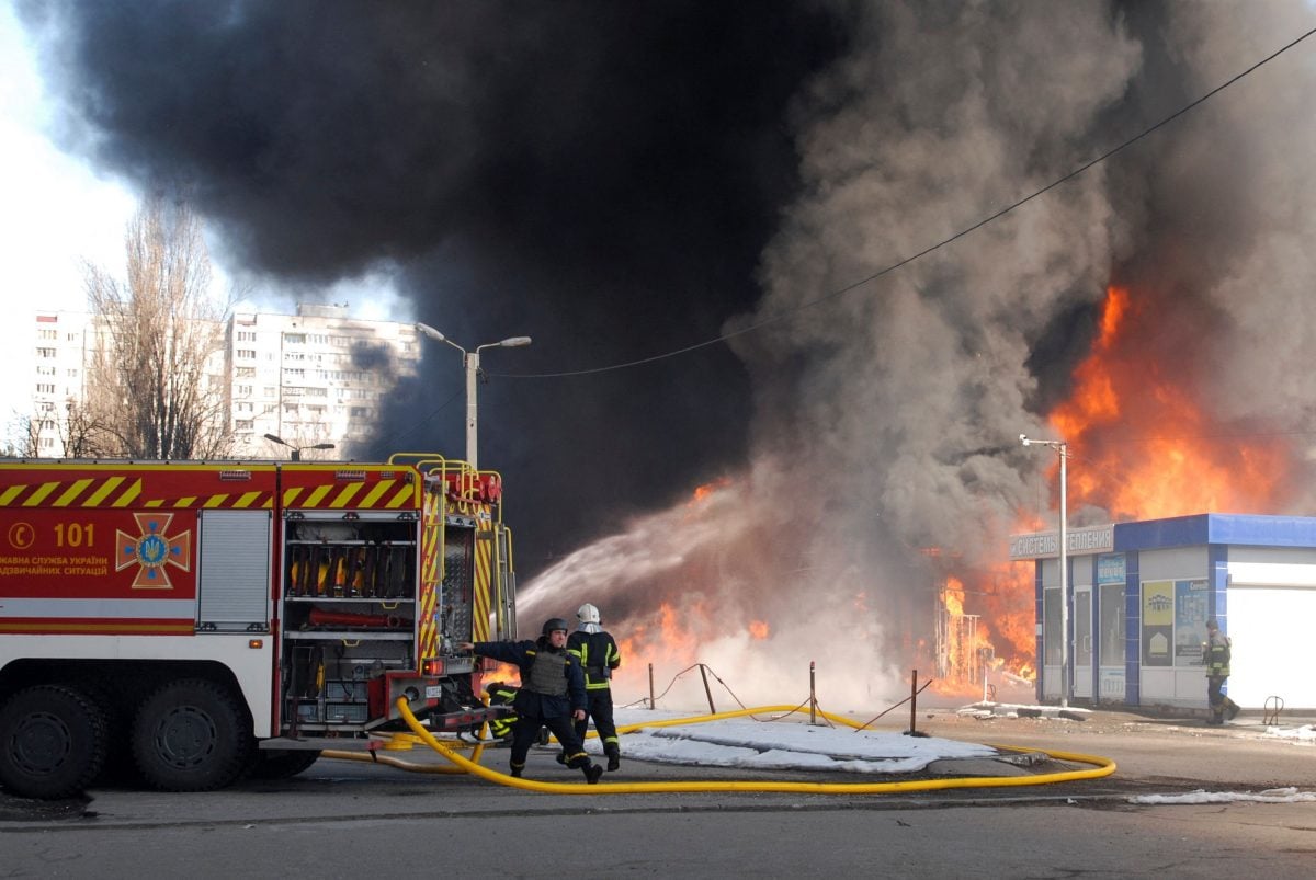 Putting out a fire after bombing (Reuters photo)