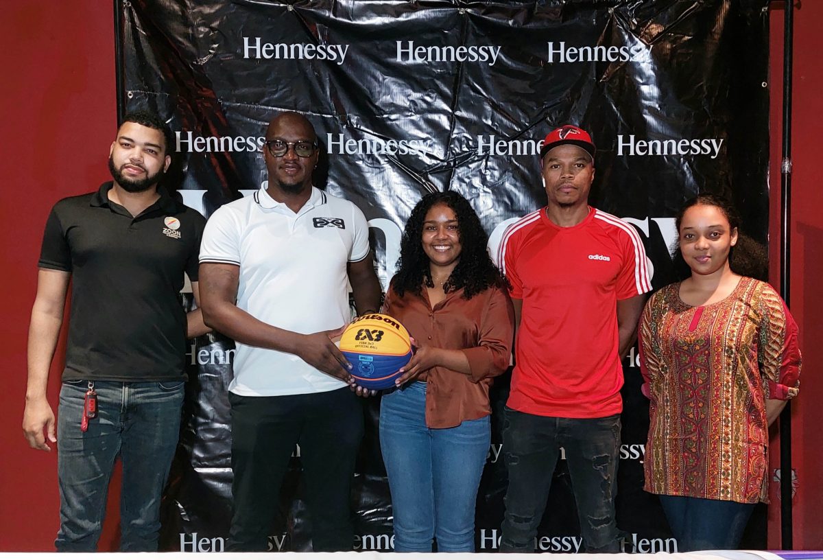 Tournament coordinator Rawle Toney (2nd from left) collecting the championship ball from Hennessy Brand Manager Atina Samad in the presence of several other tournament officials and representatives  