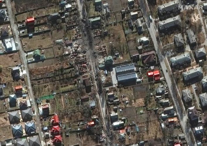 A satellite image shows destroyed military vehicles in a residential area and destroyed homes on Vokzalna Street, in Bucha, Ukraine, February 28, 2022. Maxar/via REUTERS