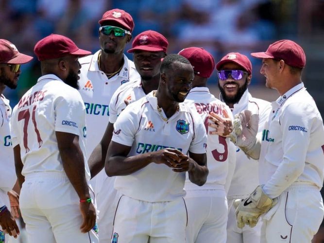 The West Indies team celebrating an early wicket against England during the 3rd test at the Grenada National Cricket Stadium