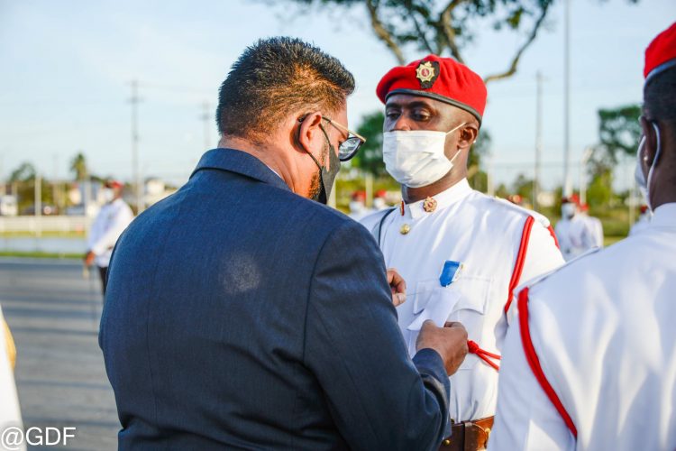 Commander-in-Chief of the Armed Forces, President Irfaan Ali conferring one of the awards yesterday (GDF photo)