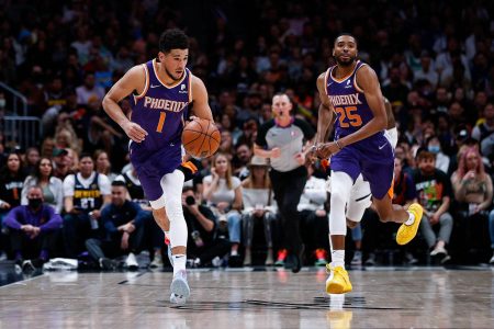 Denver, Colorado, USA; Phoenix Suns guard Devin Booker (1) dribbles the ball up court with forward Mikal Bridges (25) in the second quarter against the Denver Nuggets at Ball Arena. Mandatory Credit: Isaiah J. Downing-USA TODAY Sports