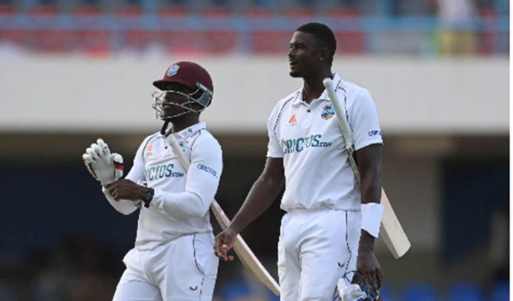 Jason Holder (right) and Nkrumah Bonner leave the field after steering West Indies to the safety of a draw on the final day.
