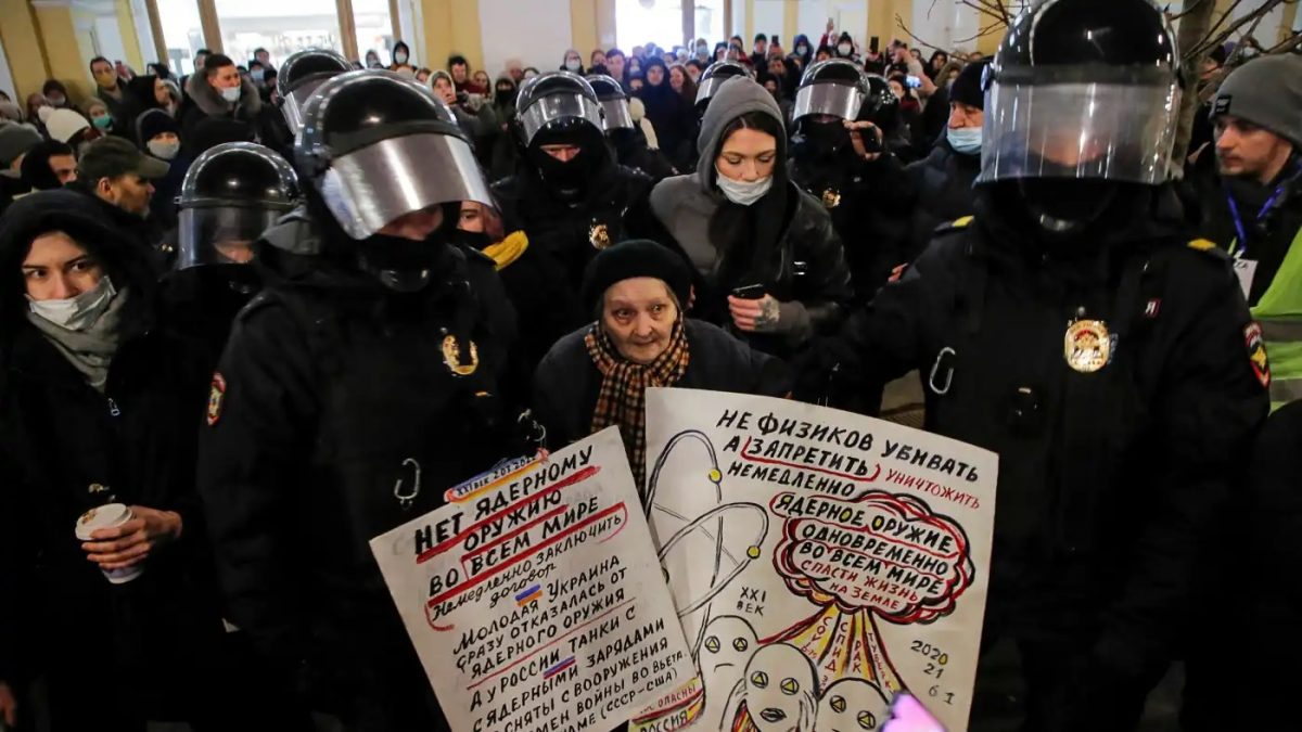 Law enforcement officers escort an elderly artist and activist, Yelena Osipova, during an anti-war protest against Russia's invasion of Ukraine, in Saint Petersburg, Russia March 2