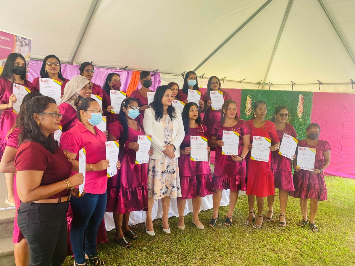 Participants in the garment construction course posing with Minister of Human Services and Social Security Dr Vindhya Persaud (fourth from left) in front row.

