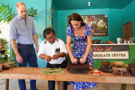 Britain’s Prince William and Catherine, Duchess of Cambridge try cocoa grinding as they visit Che’il Chocolate Farm at Stann Creek district in Belize amid their tour of the Caribbean, March 20, 2022. Paul Edwards/Pool via REUTERS