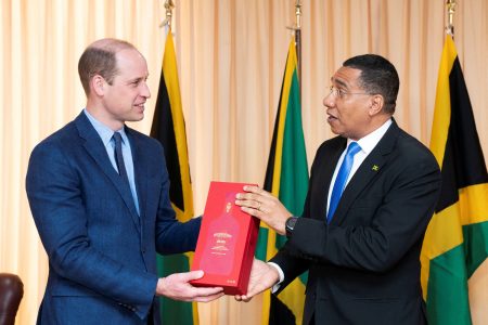 Jamaica's Prime Minister Andrew Holness presents Britain's Prince William with a bottle of Appleton Estate Ruby during a meeting at his office, on day five of the Platinum Jubilee Royal Tour of the Caribbean, in Kingston, Jamaica, March 23, 2022. Jane Barlow/Pool via REUTERS