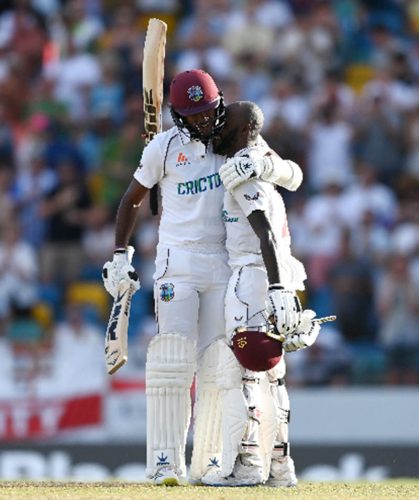 Captain Kraigg Brathwaite (left) embraces Jermaine Blackwood after the Jamaican completed his third Test hundred yesterday. (Photo courtesy CWI Media)