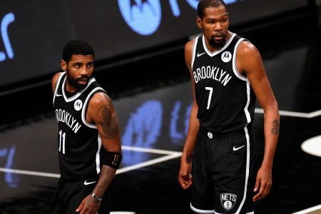 Kyrie Irving, left and Kevin Durant led the Brooklyn Nets to a blow-out win over the Philadelphia 76ers, Thursday night.