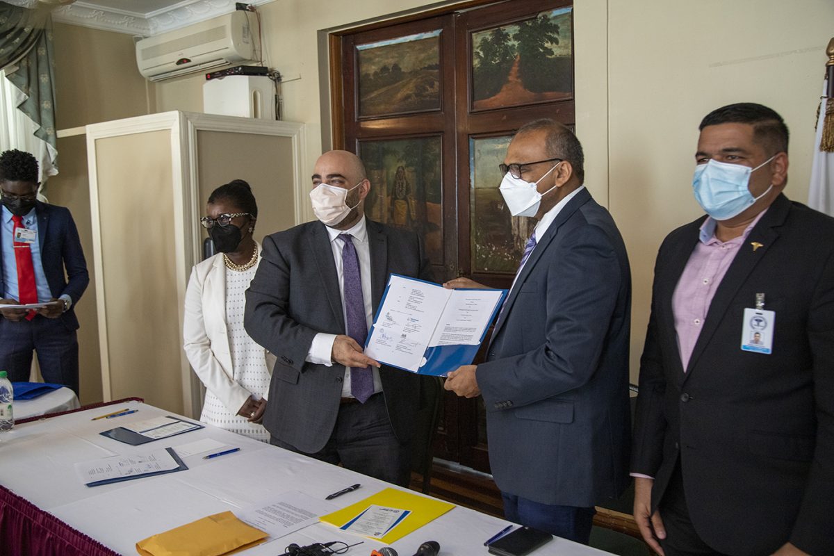 Health Minister Dr Frank Anthony (second from right) signing the agreement (Northwell photo)
