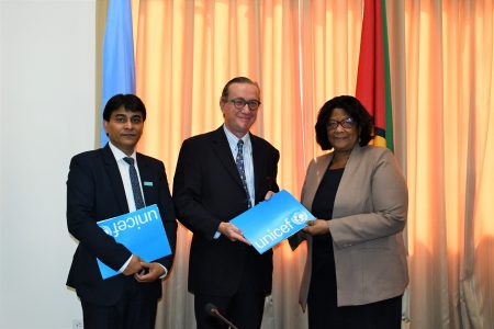 UNICEF Representative to Guyana and Suriname Nicolas Pron (centre), along with Deputy Representative Irfan Akhtar (left), presents UNICEF’s Country Programme Document 2022-2026 to Permanent Secretary of Guyana’s Ministry of Foreign Affairs, Ambassador Elisabeth Harper. (UNICEF photo)