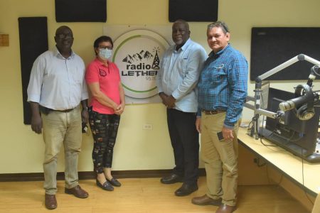 Prime Minister Mark Phillips (second from right) at the state-run Lethem Radio Station (Office of the Prime Minister photo)