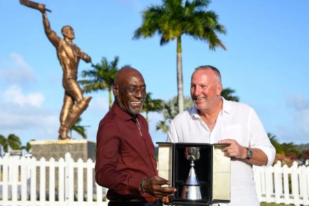 Sir Vivian Richards (left) and Ian Botham pose with the new Richards-Botham Trophy.