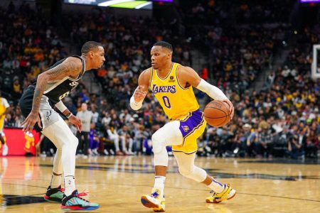 Los Angeles Lakers guard Russell Westbrook (0) dribbles against San Antonio Spurs guard Dejounte Murray (5) in the second half at the AT&T Center. Mandatory Credit: Daniel Dunn-USA TODAY Sports
