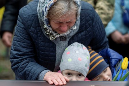 Maria, wife of a Ukrainian soldier Vasyl Vekliuk, 59, who died in a shelling near Popasna in the Luhansk region, amid Russia’s invasion of Ukraine, attends his funeral in Stebnyk, Lviv region, Ukraine, March 30, 2022. REUTERS/Viacheslav Ratynskyi