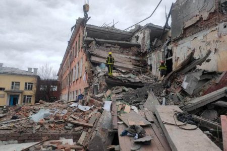 Rescuers remove debris from a school building damaged by shelling in Chernihiv, Ukraine, March 7, 2022.  Courtesy: Press service of the State Emergency Service of Ukraine
