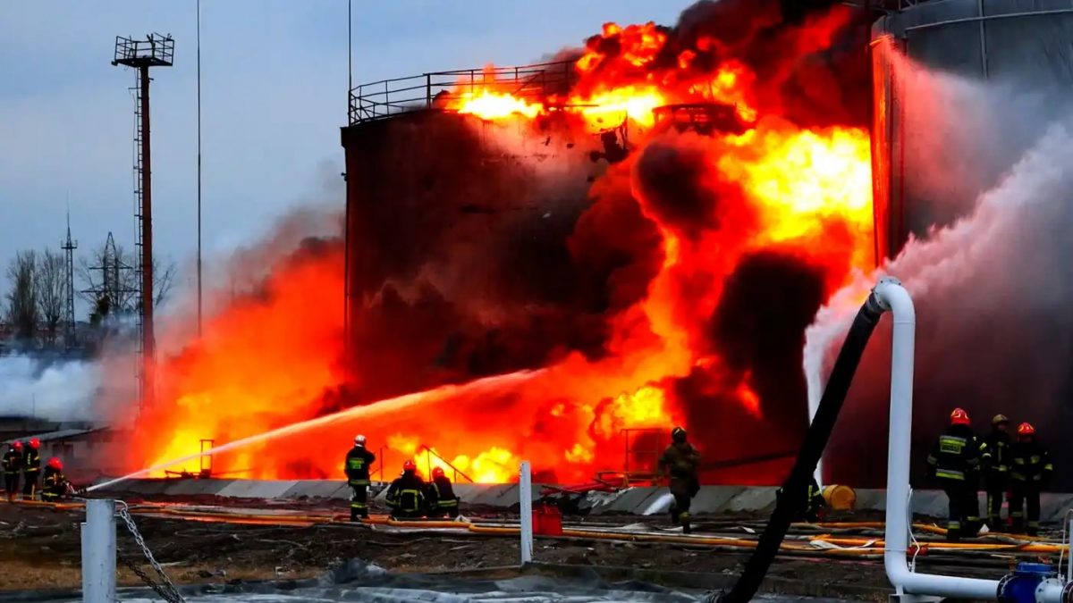 Rescuers work at a site of fuel storage facilities hit by cruise missiles, as Russia's attack on Ukraine continues, in Lviv, in this handout picture released March 27   © Reuters