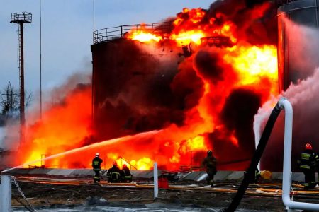 Rescuers work at a site of fuel storage facilities hit by cruise missiles, as Russia's attack on Ukraine continues, in Lviv, in this handout picture released March 27   © Reuters