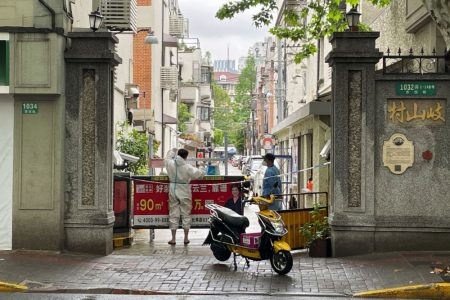 A courier in a protective suit makes deliveries to a residential compound amid the coronavirus disease (Covid-19) outbreak in Shanghai, China April 23, 2022. — Reuters pic