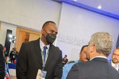 Crime Chief Wendell Blanhum (left) meets with the President of the Republic of Colombia, Ivan Duque Marquez at the AMERIPOL Conference. (Police photo)