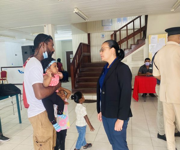  Minister within the Ministry of Housing and Water Susan Rodrigues meeting with one of the citizens who attended the outreach
