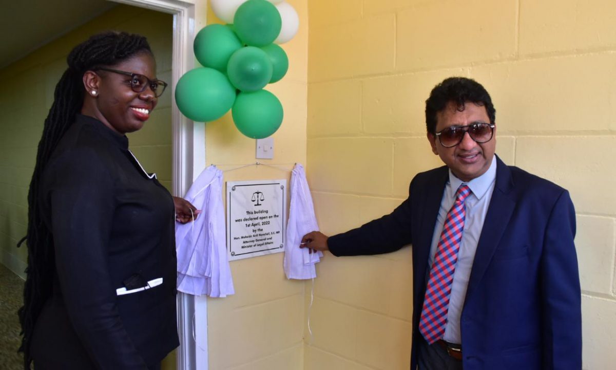Magistrate Wanda Fortune (left) and Attorney General Anil Nandlall SC unveiled the commemorative plaque at yesterday’s commissioning of the new Kwakwani Magistrate’s Court building.  (DPI photo)