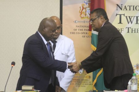 Aubrey Norton (left) being welcomed into the National Assembly by Speaker Manzoor Nadir after being administered his oath of office (Orlando Charles Photo)