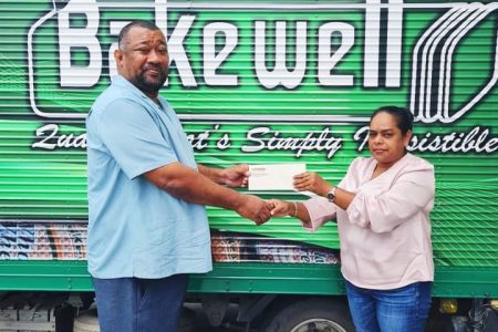 Natasha Bhikhari hands over sponsorship to RHTYSC Secretary/CEO Hilbert Foster for 2022