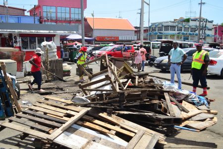 Time for these to go: Part of the city’s major clean-up at the Stabroek Market yesterday.  (Orlando Charles photo)