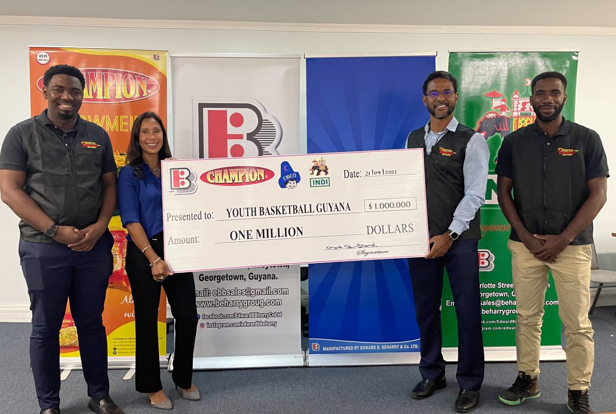 Anjuli Beharry-Strand (2nd from left) of Edward B. Beharry & Company, presenting the sponsorship cheque to YBG Co-Director Rayad Boyce (2nd from right) in the presence of association representatives Taquain Vieira, and Selvaughn Moseley
