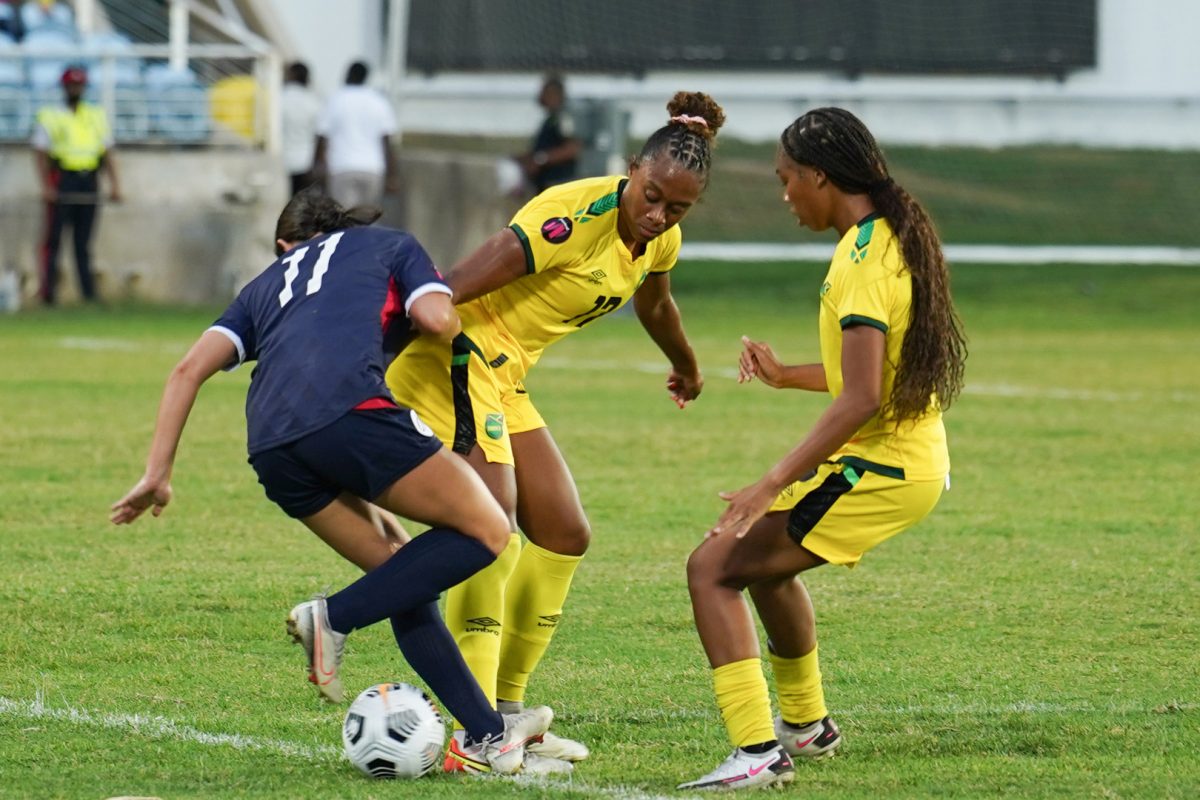 Alyssa Oviedo of the Dominican Republic (left) and Sashana Campbell of Jamaica during their match on Tuesday night. (Photo: CONCACAF) 