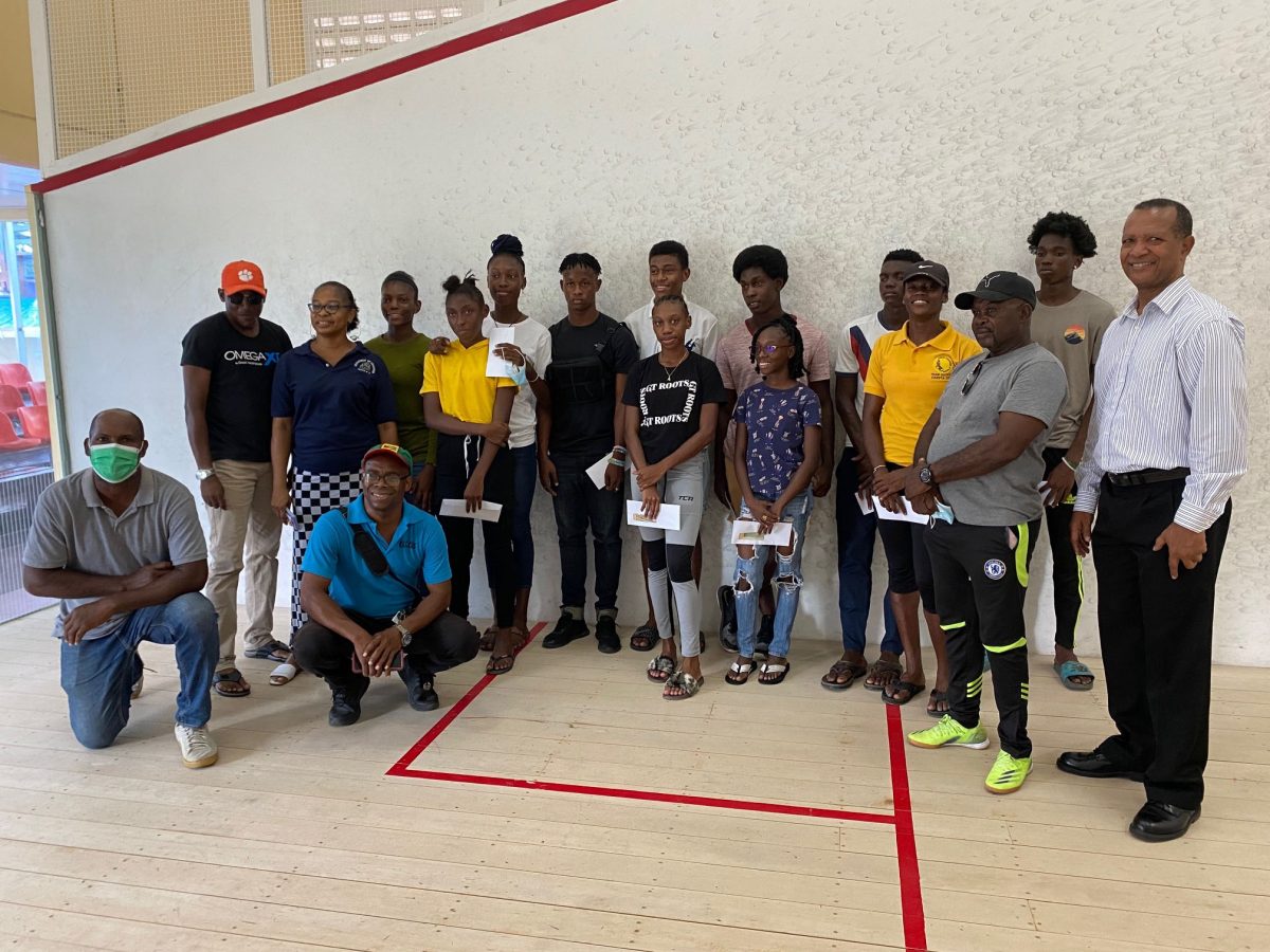 Members of the Guyana Committee of Service made presentations of tokens to each of the CARIFTA Games 
athletes and Team Manager, Nadine Trotz prior to their departure today for Jamaica. (Emmerson Campbell photo)