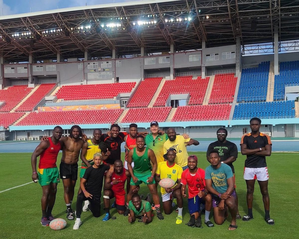 Members of the ‘Green Machine’ pose for picture following a recent practice session inside the Thomas Robinson Stadium in The Bahamas. 