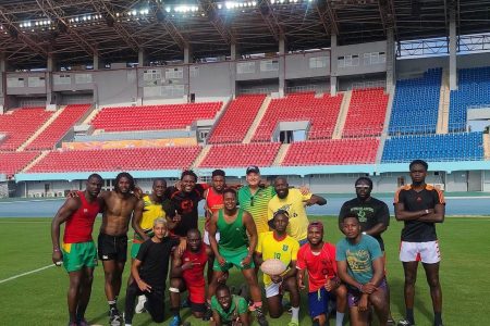 Members of the ‘Green Machine’ pose for picture following a recent practice session inside the Thomas Robinson Stadium in The Bahamas. 