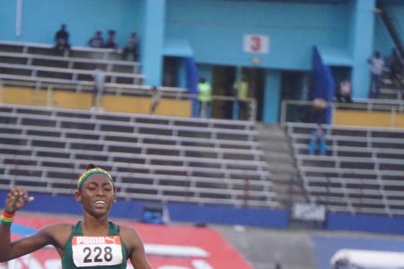 Golden Run! Attoya Harvey was all alone at the finish line in the Girls U-17 1500m final. (Emmerson Campbell photo)