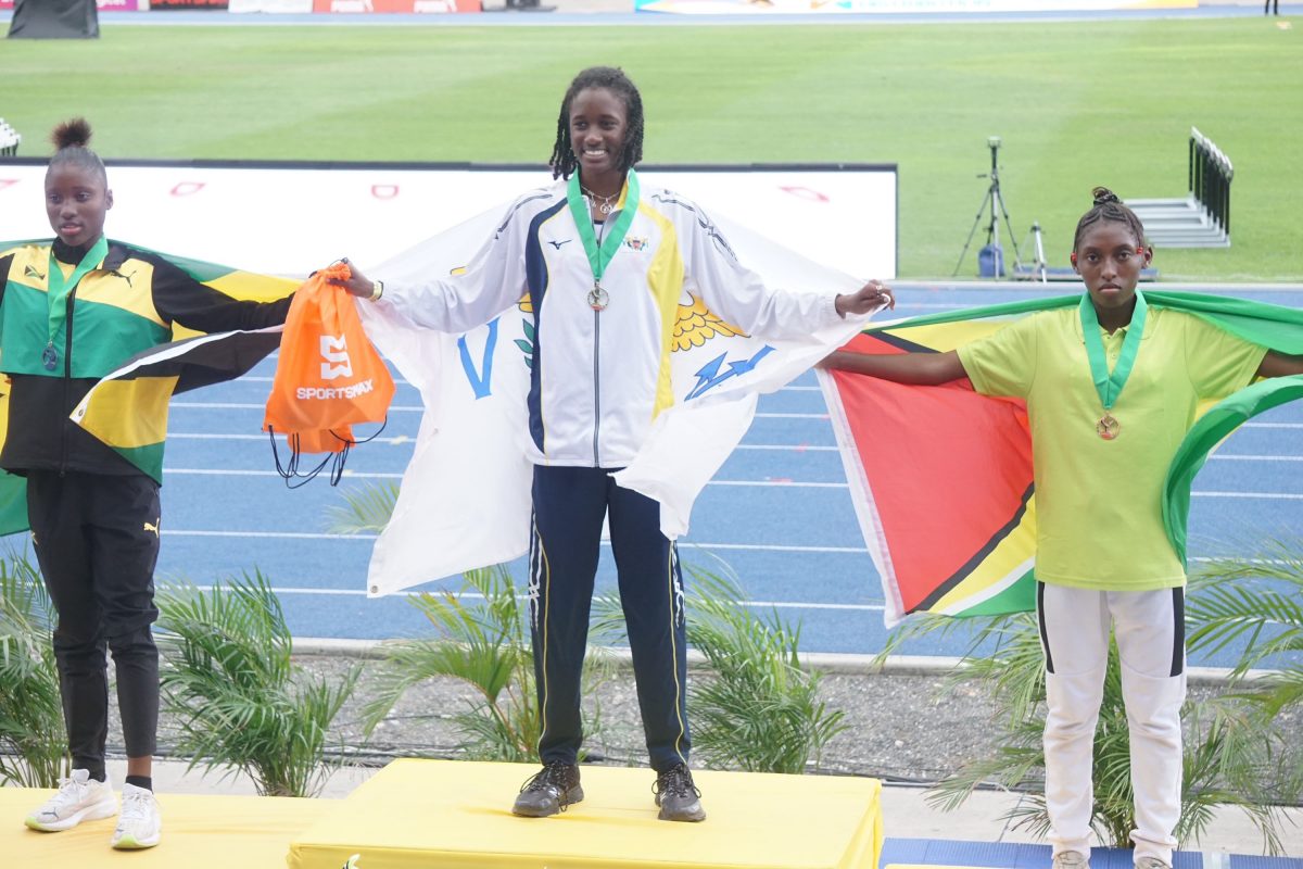Attoya Harvey completed her CARIFTA Games debut here in Kingston, Jamaica with a set of medals.  A gold in the 1500m, a silver in the 3000m and a bronze in the 800m. (Emmerson Campbell photo) 